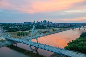 aerial of the Kit Bond Bridge, Missouri River, and downtown Kansas City at dusk