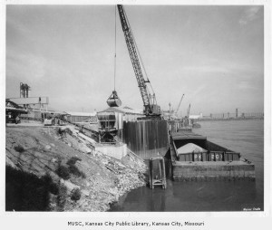 Historic photo of barge unloading at Port of Kansas City