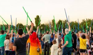 Hundreds of Star Wars fans raise their lightsabers at Berkley Riverfront