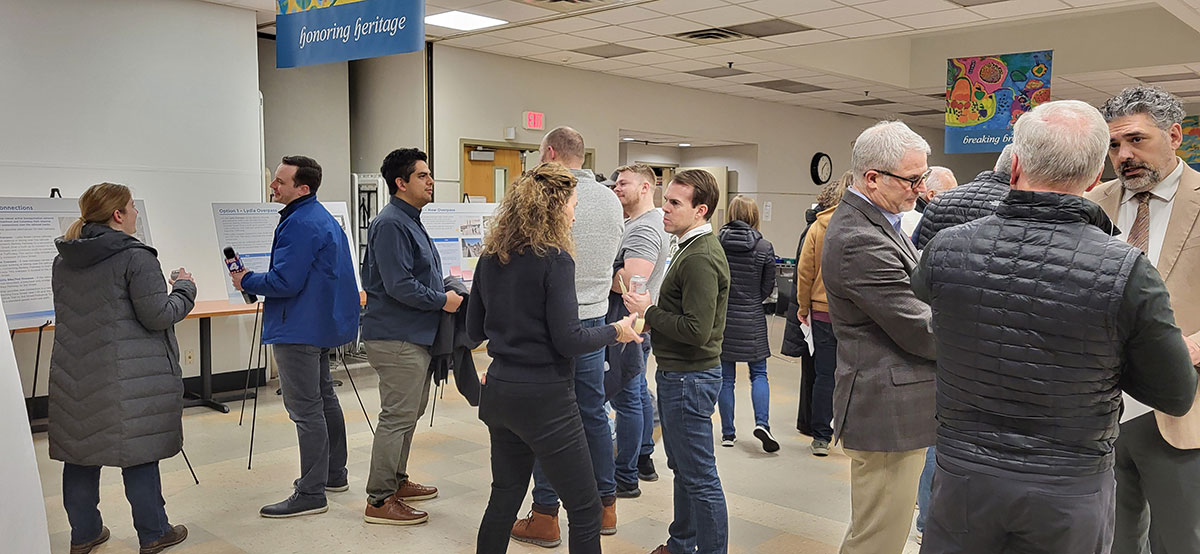 Attendees discuss options with the project team at the public meeting